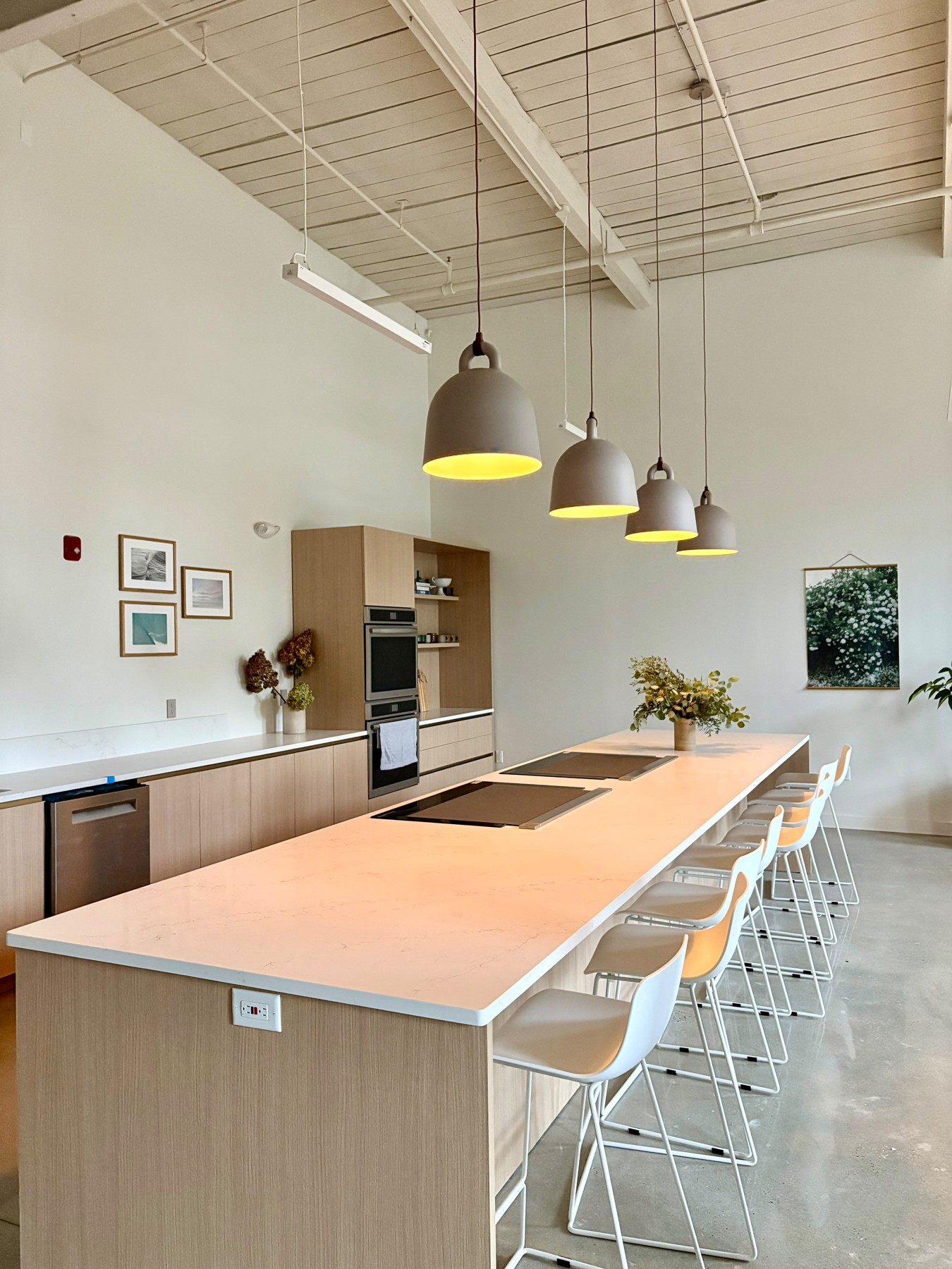 Kitchen island and seating inside WOVEN Studio & Kitchen